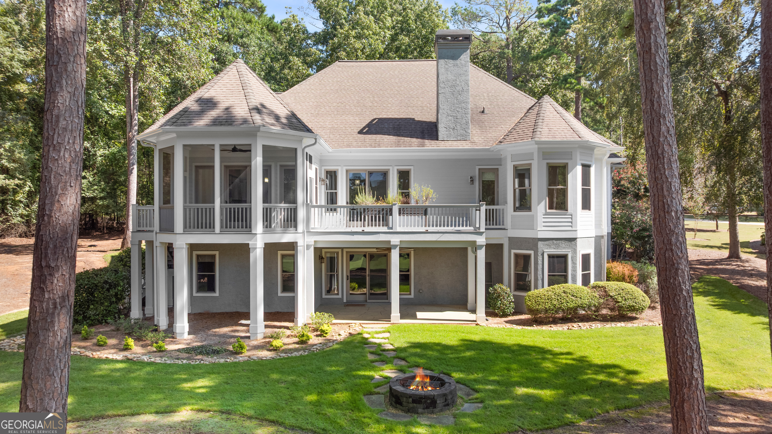 1011 Ridge Terrace Greensboro, GA 30642 - Photo 9 of 72 a front view of a house with a yard table and chairs