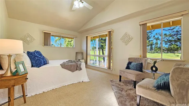 a bedroom with a bed and a couch