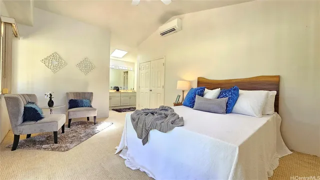 a bed room with a bed and a chair