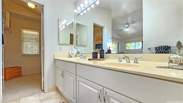 a bathroom with a sink a vanity and a mirror