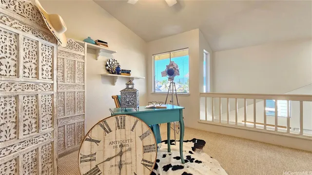 a dining room with furniture and a floor to ceiling window