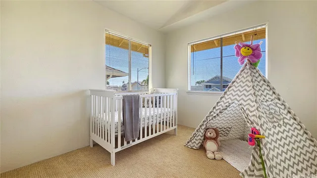 a view of a baby crib and stairs