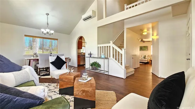 a living room with fireplace furniture and a wooden floor