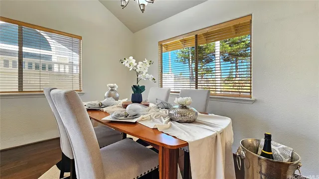 a dining room with furniture and window
