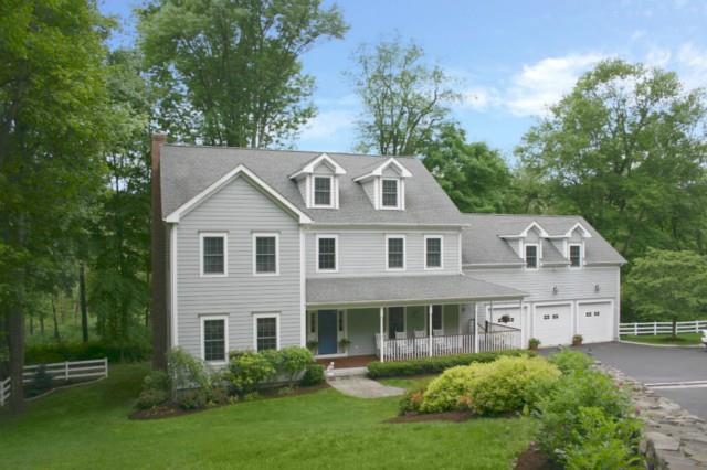 163 North Street Ridgefield, CT 06877 - Photo 1 of 1 a front view of a house with a yard