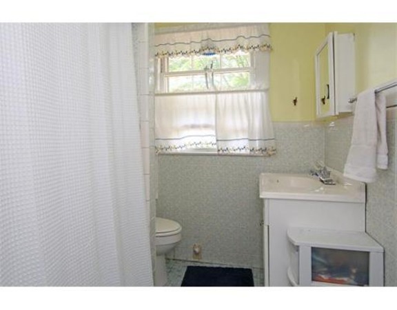 11 Jackson Road Medford, MA 02155 - Photo 12 of 12 a bathroom with a sink a toilet and a window