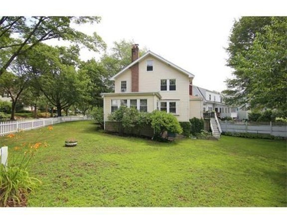 11 Jackson Road Medford, MA 02155 - Photo 3 of 12 a view of a house with swimming pool and a yard