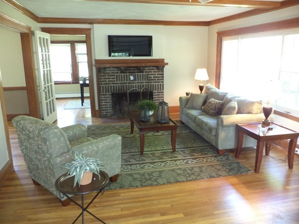 11 Jackson Road Medford, MA 02155 - Photo 6 of 12 a living room with furniture and a fireplace