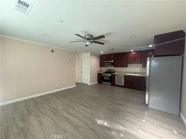 a view of kitchen with microwave and stove