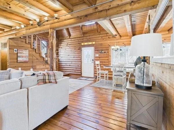 a living room with furniture and a table
