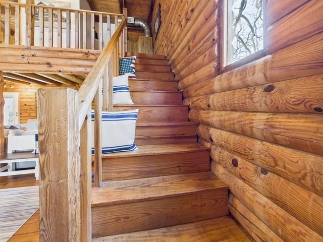 7386 Clint Court Athens, TX 75752 - Photo 27 of 40 a view of entryway with wooden floor and stairs