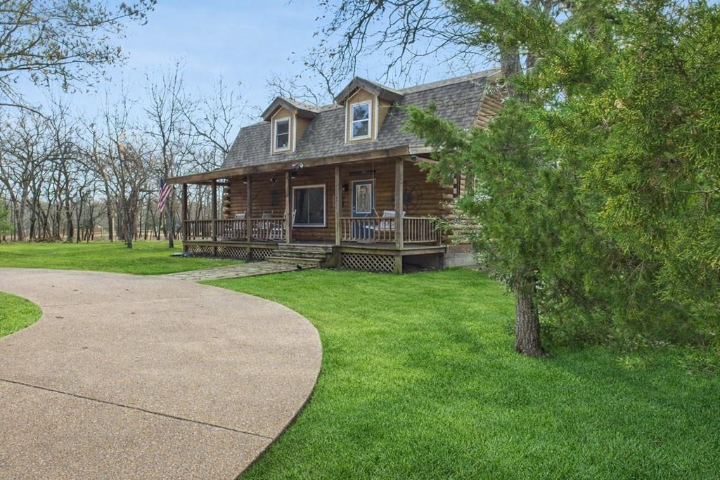 7386 Clint Court Athens, TX 75752 - Photo 3 of 40 a front view of a house with garden