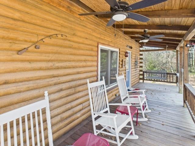 7386 Clint Court Athens, TX 75752 - Photo 6 of 40 a view of a patio with table and chairs with wooden floor and fence