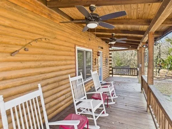 a view of a chairs and table on the deck