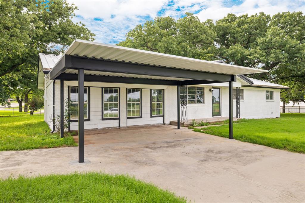 3301 South Murvil Street Decatur, TX 76234 - Photo 5 of 28 A brand new carport has been added to provide your vehicles with shade and protection from the elements.