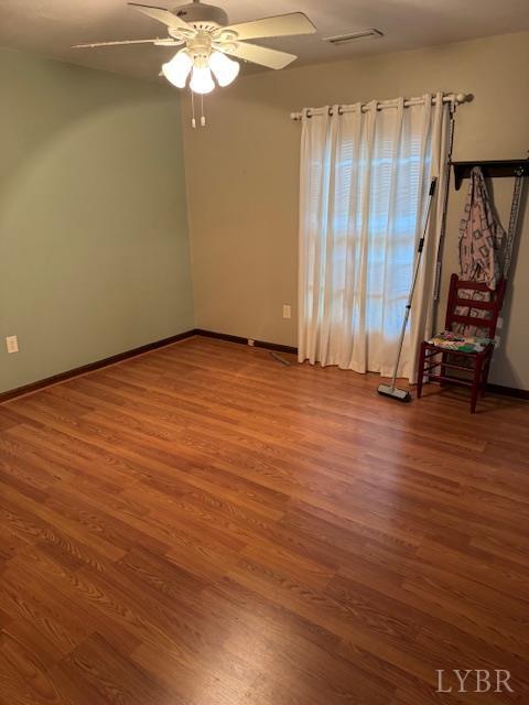 1092 Mount Pleasant Road Pamplin, VA 23958 - Photo 12 of 17 an empty room with wooden floor and windows