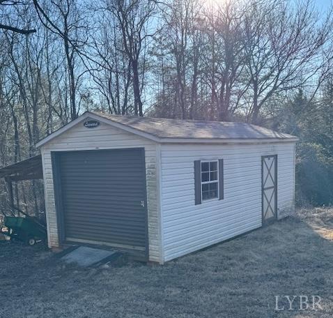 1092 Mount Pleasant Road Pamplin, VA 23958 - Photo 4 of 17 a front view of a house with garage