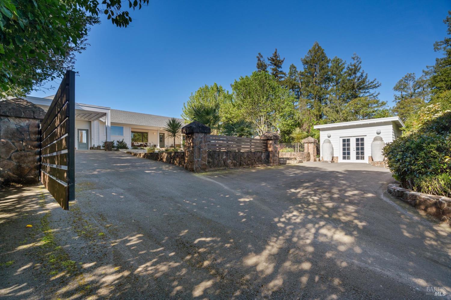 1236 North Fitch Mountain Road Healdsburg, CA 95448 - Photo 24 of 70 a view of a house with a backyard