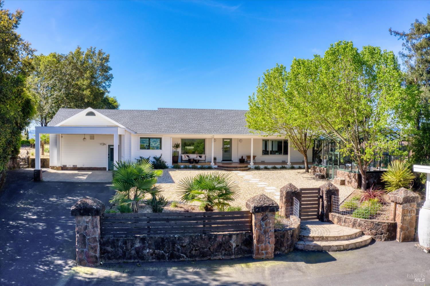 1236 North Fitch Mountain Road Healdsburg, CA 95448 - Photo 25 of 70 a front view of a house with a yard
