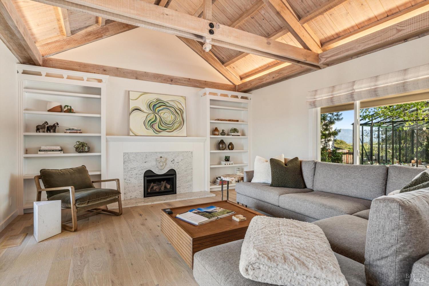 1236 North Fitch Mountain Road Healdsburg, CA 95448 - Photo 32 of 70 a living room with furniture and a fireplace