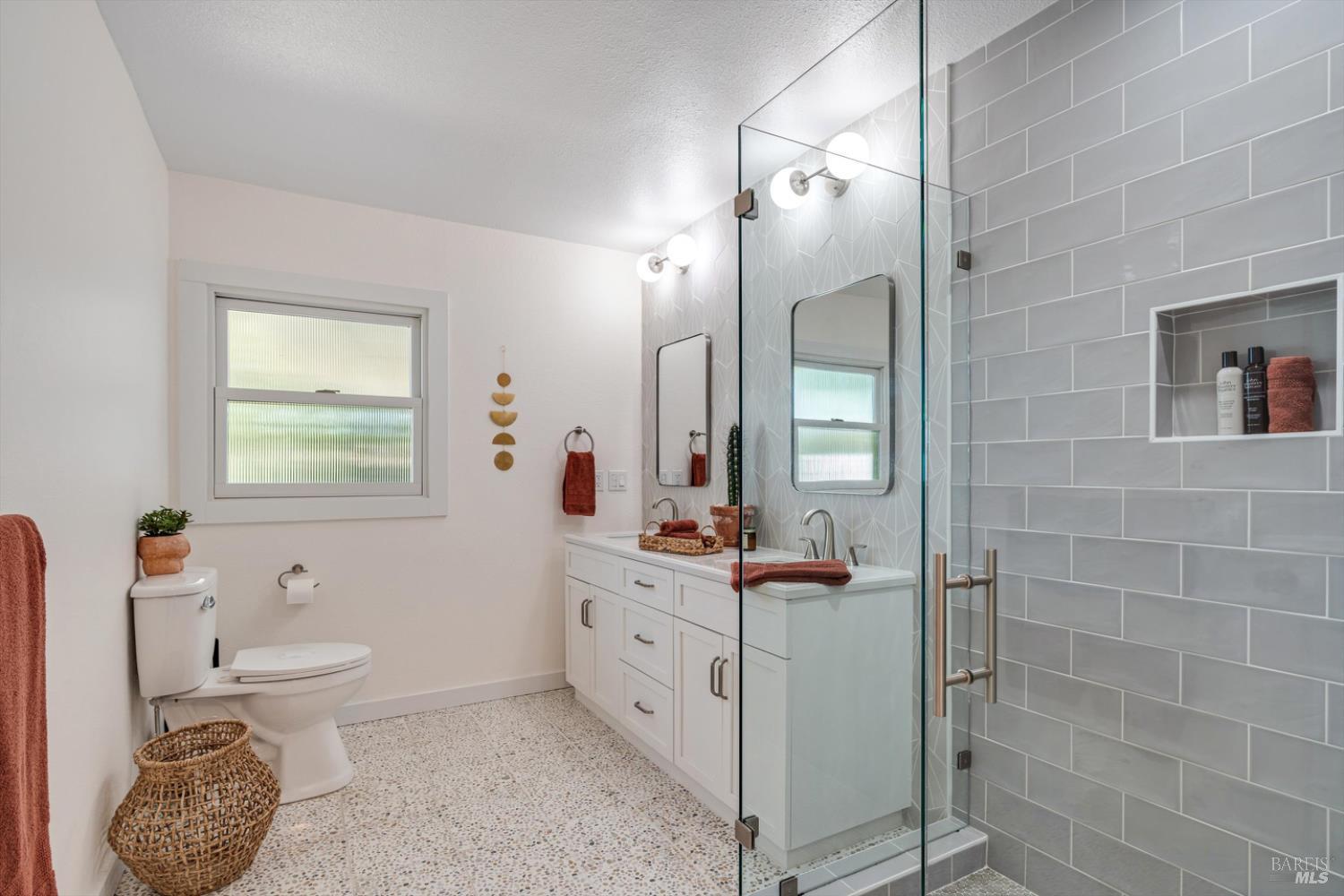 1236 North Fitch Mountain Road Healdsburg, CA 95448 - Photo 43 of 70 a bathroom with a toilet a sink and mirror