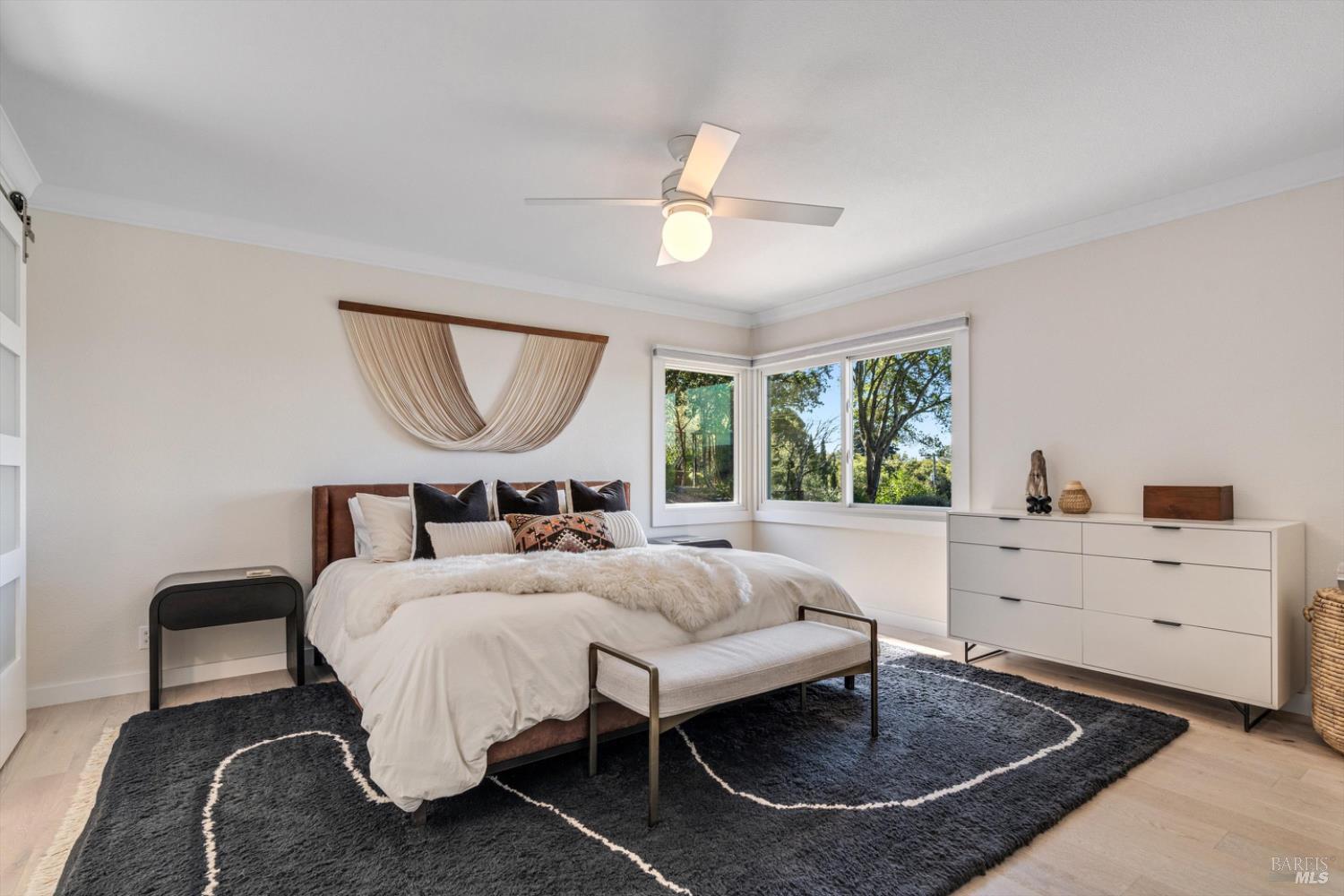 1236 North Fitch Mountain Road Healdsburg, CA 95448 - Photo 45 of 70 a bed room with a bed a mirror and a table