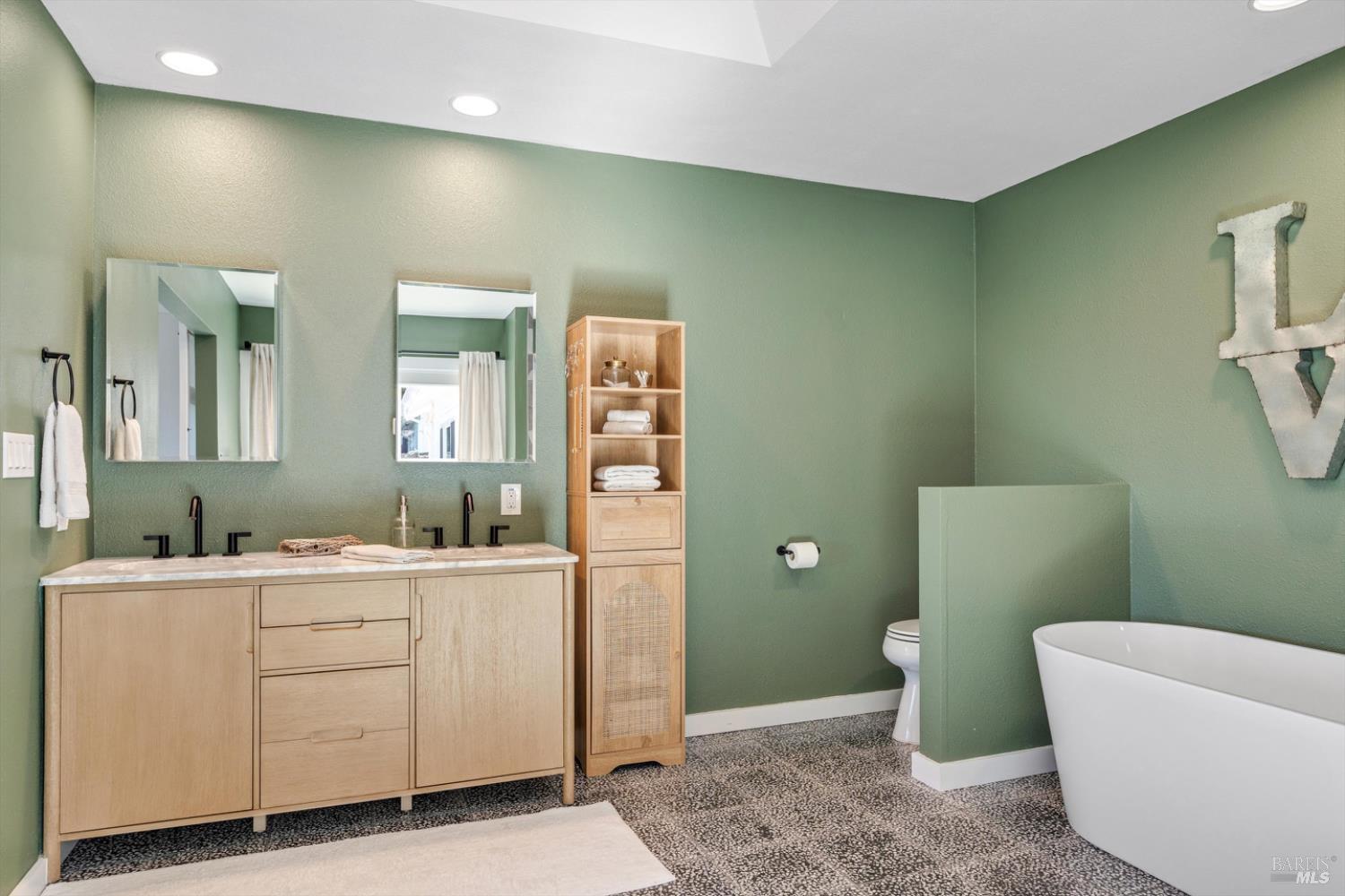 1236 North Fitch Mountain Road Healdsburg, CA 95448 - Photo 48 of 70 a bathroom with a sink and a mirror