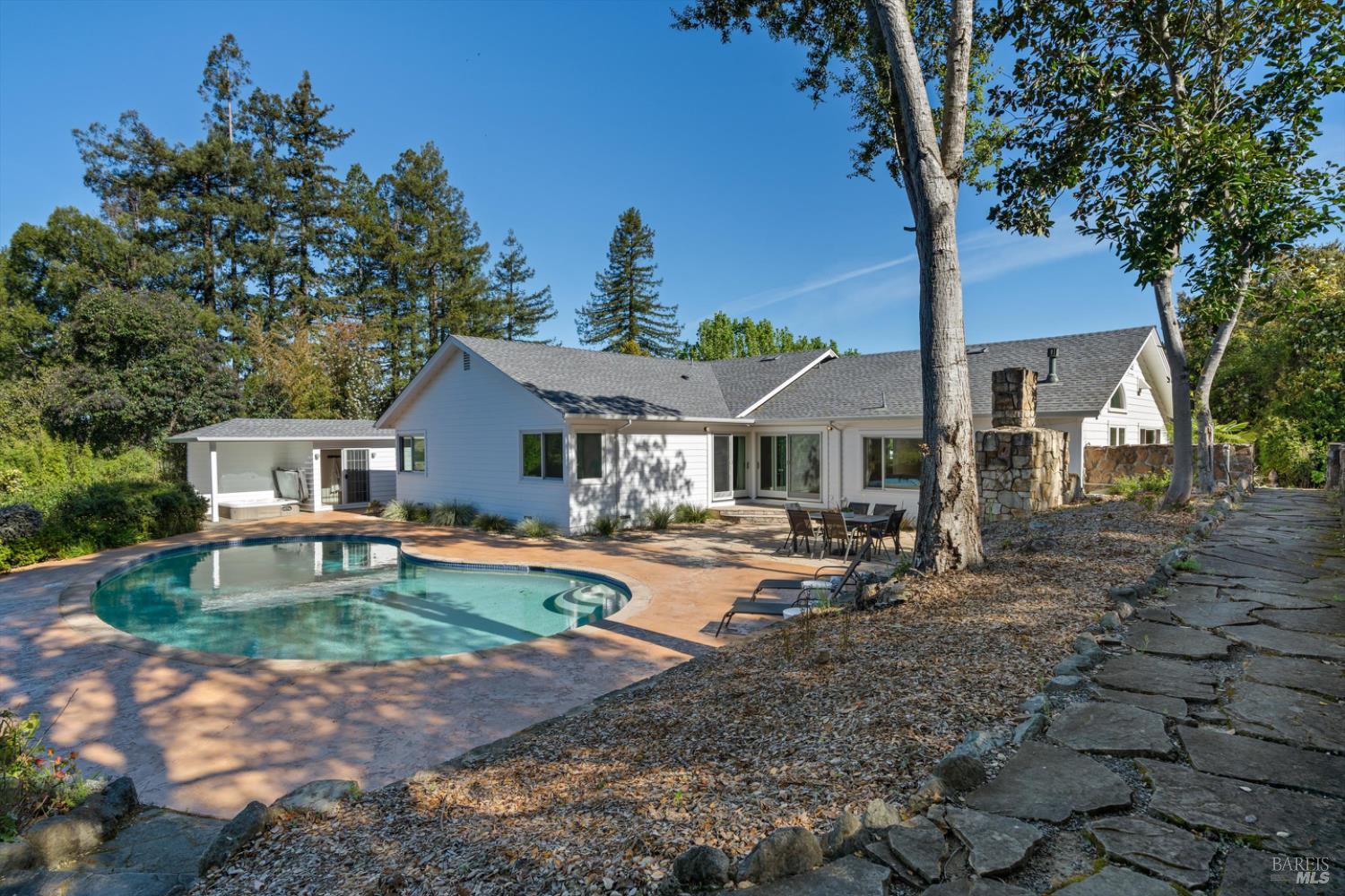 1236 North Fitch Mountain Road Healdsburg, CA 95448 - Photo 50 of 70 a front view of a house with yard patio and fire pit