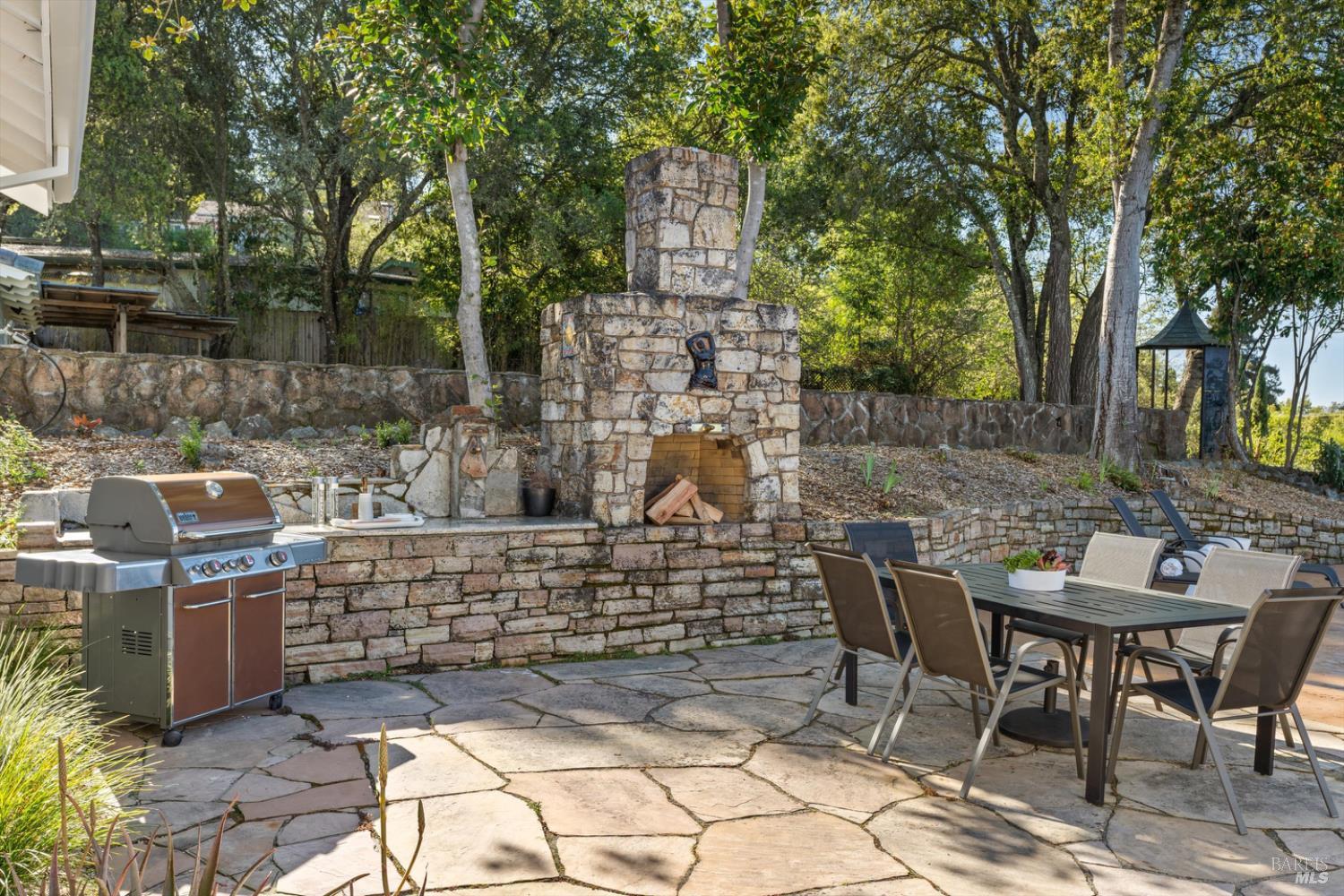 1236 North Fitch Mountain Road Healdsburg, CA 95448 - Photo 52 of 70 a view of a patio with table and chairs and potted plants