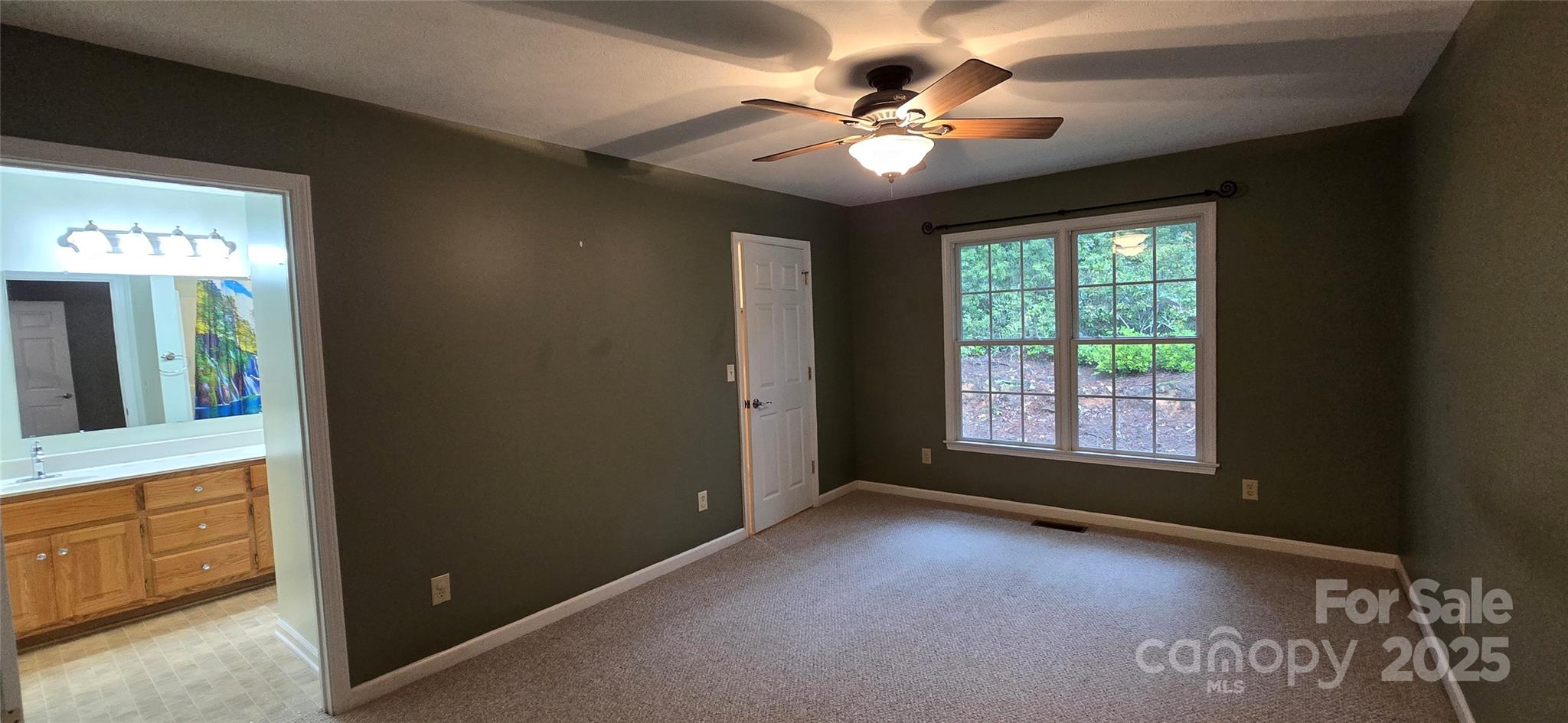 221 Flat Branch Trail Mill Spring, NC 28756 - Photo 15 of 32 a view of an empty room with a window