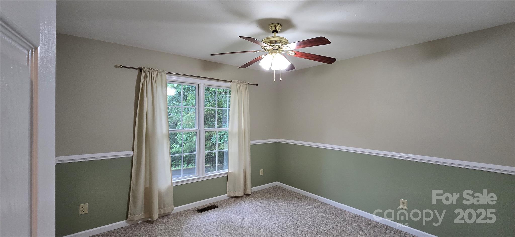 221 Flat Branch Trail Mill Spring, NC 28756 - Photo 23 of 32 a view of an empty room with a window