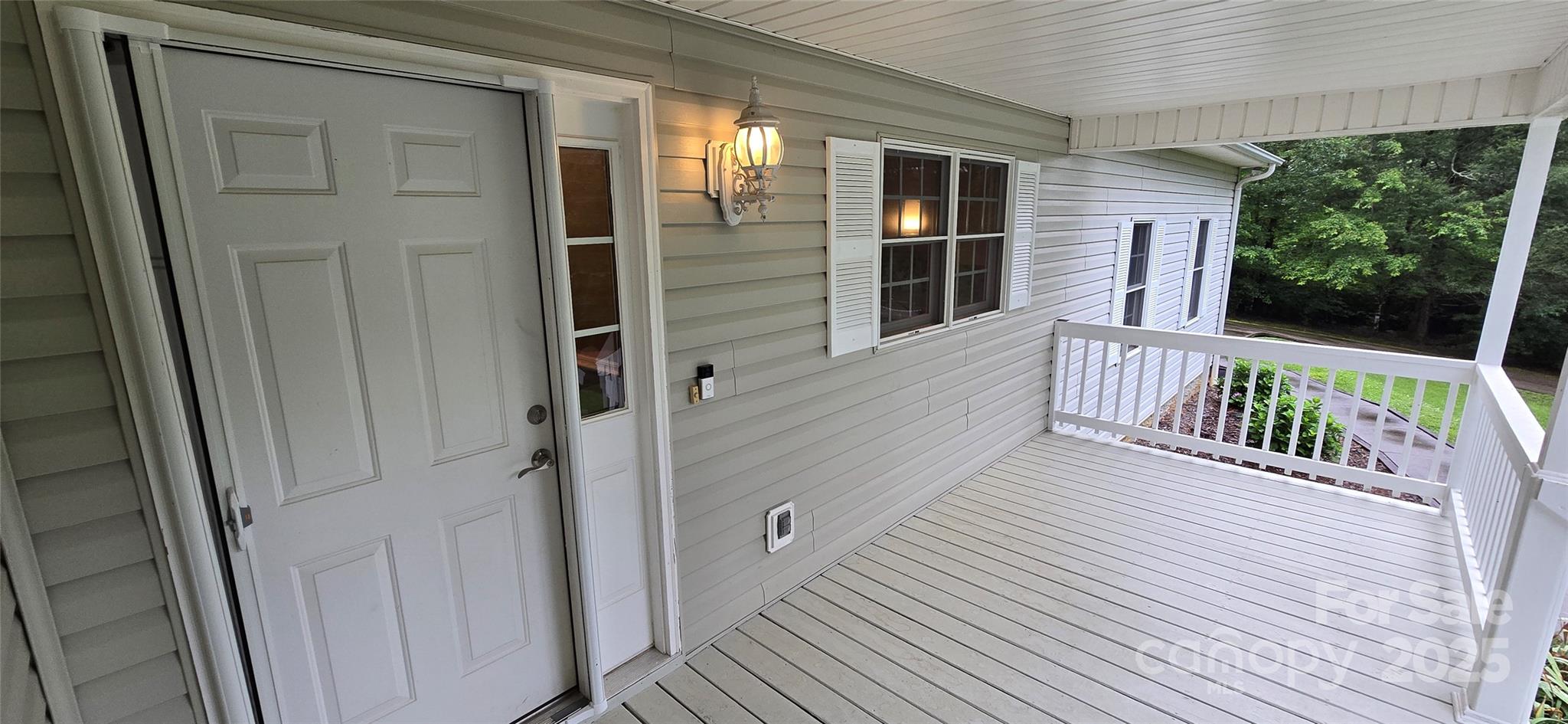 221 Flat Branch Trail Mill Spring, NC 28756 - Photo 27 of 32 a view of balcony with wooden floor