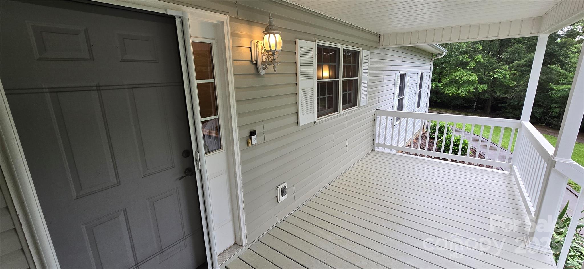 221 Flat Branch Trail Mill Spring, NC 28756 - Photo 28 of 32 a balcony with wooden floor