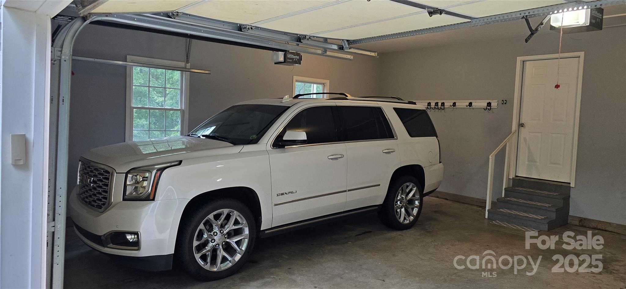 221 Flat Branch Trail Mill Spring, NC 28756 - Photo 8 of 32 a view of a car in garage