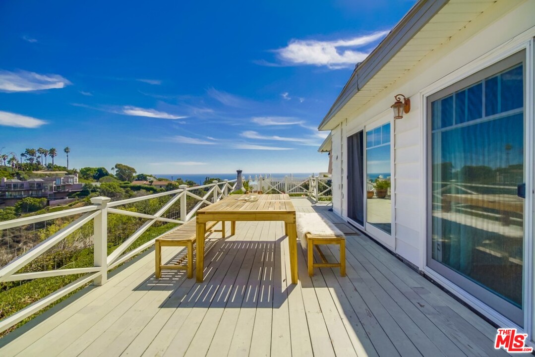 29500 Heathercliff Road, Unit 119 Malibu, CA 90265 - Photo 2 of 47 a view of a balcony with wooden floor