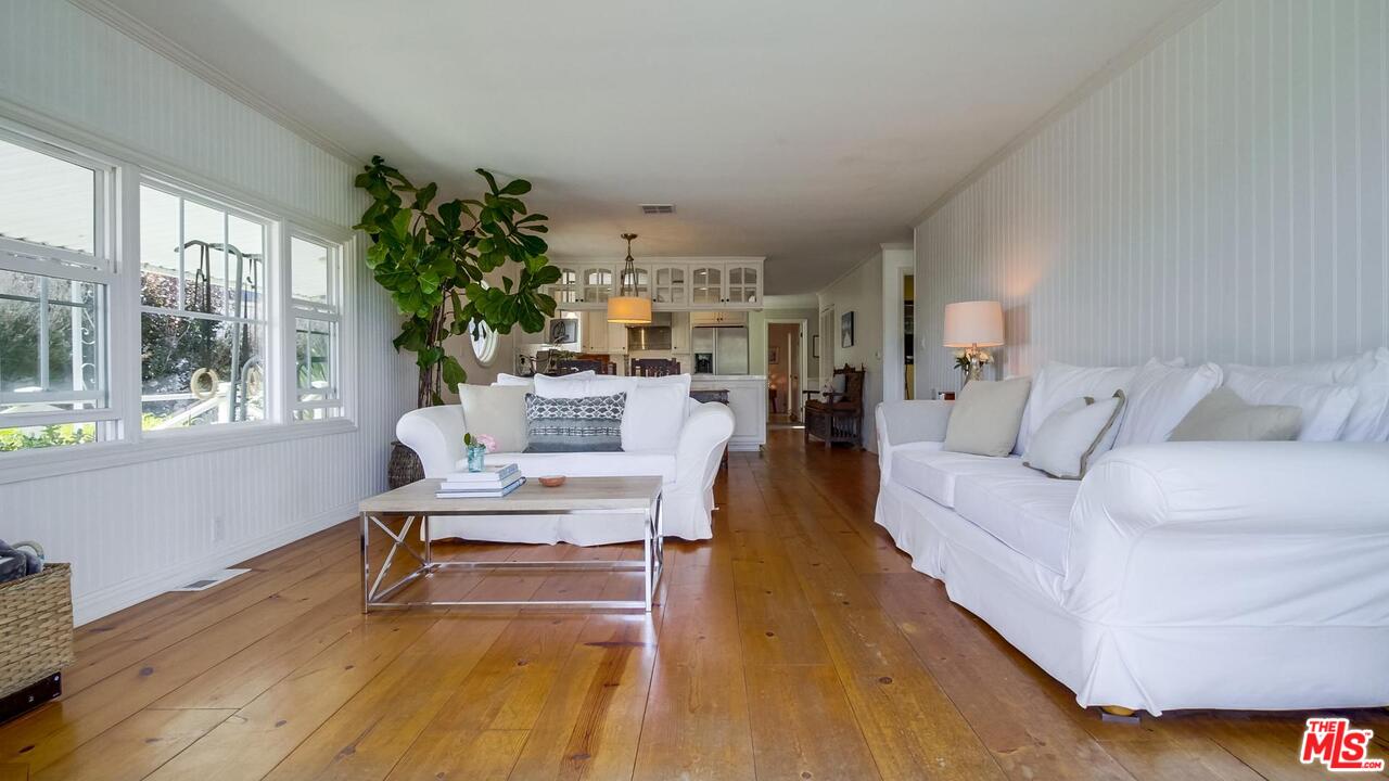 29500 Heathercliff Road, Unit 119 Malibu, CA 90265 - Photo 11 of 47 a living room with furniture and a large window