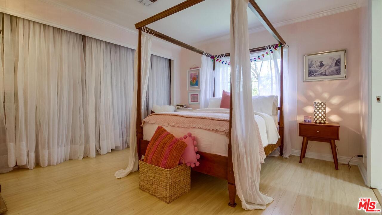 29500 Heathercliff Road, Unit 119 Malibu, CA 90265 - Photo 24 of 47 a bed room with a bed and a chair