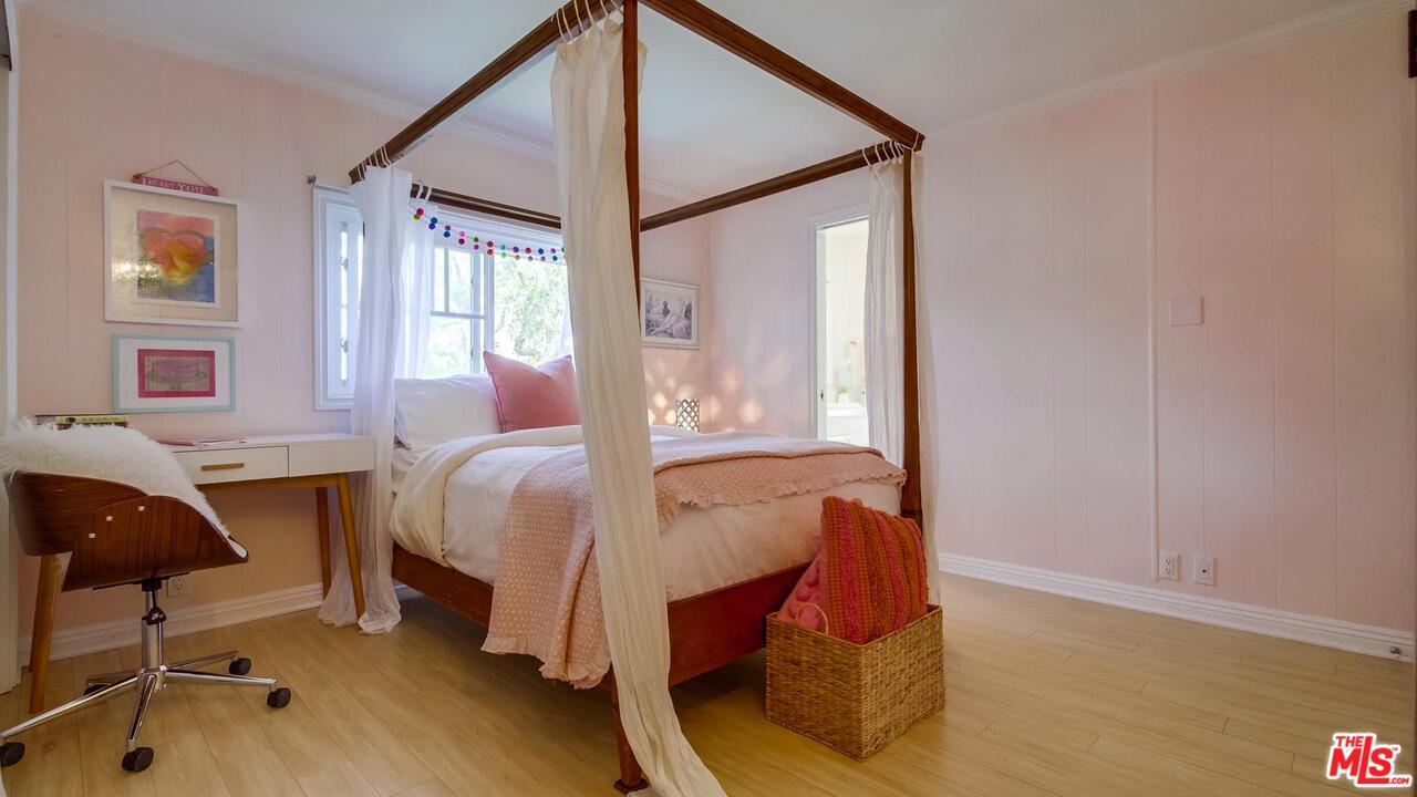 29500 Heathercliff Road, Unit 119 Malibu, CA 90265 - Photo 25 of 47 a bed room with a bed and a chair