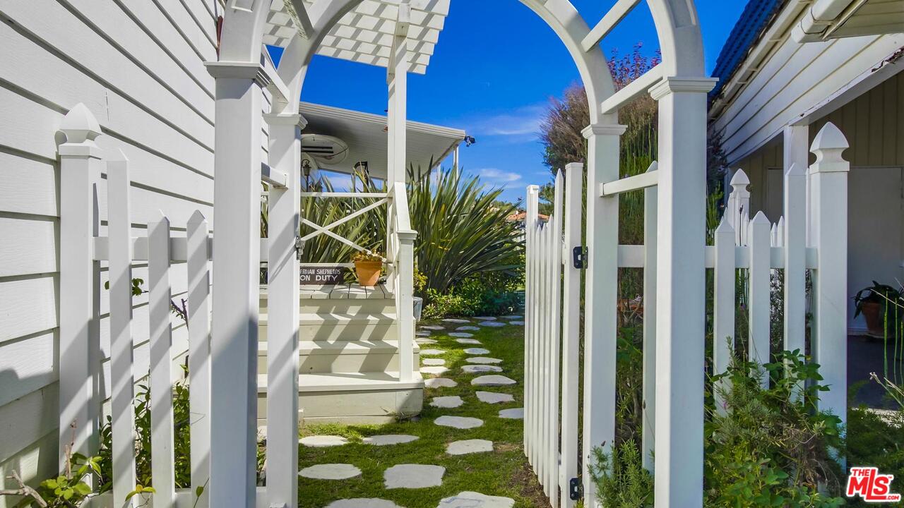 29500 Heathercliff Road, Unit 119 Malibu, CA 90265 - Photo 42 of 47 a view of a brick house with a fountain