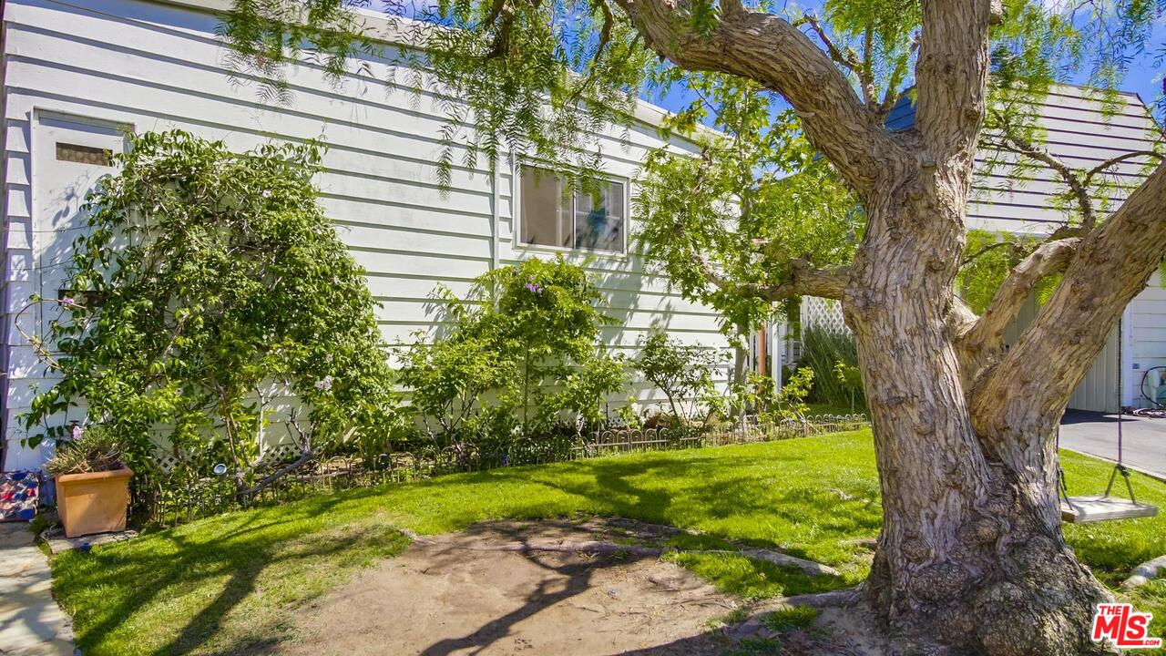 29500 Heathercliff Road, Unit 119 Malibu, CA 90265 - Photo 45 of 47 a view of a garden with a tree