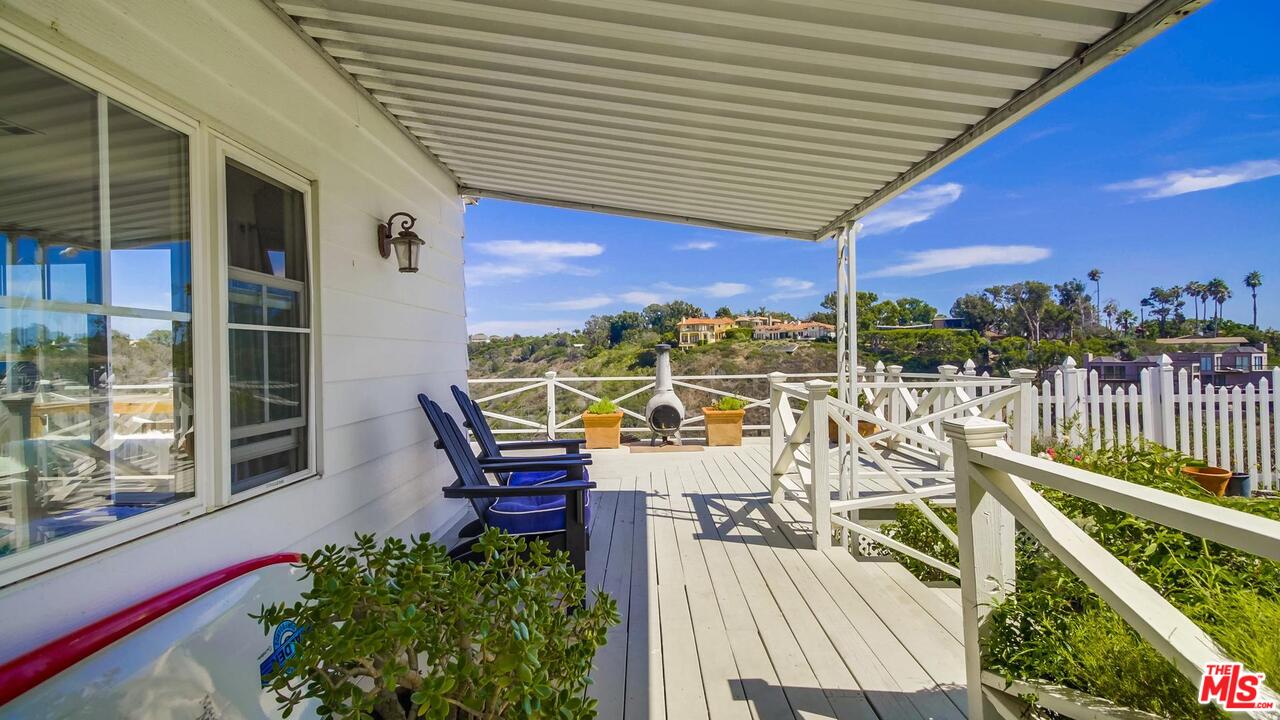 29500 Heathercliff Road, Unit 119 Malibu, CA 90265 - Photo 8 of 47 a view of a balcony with chairs