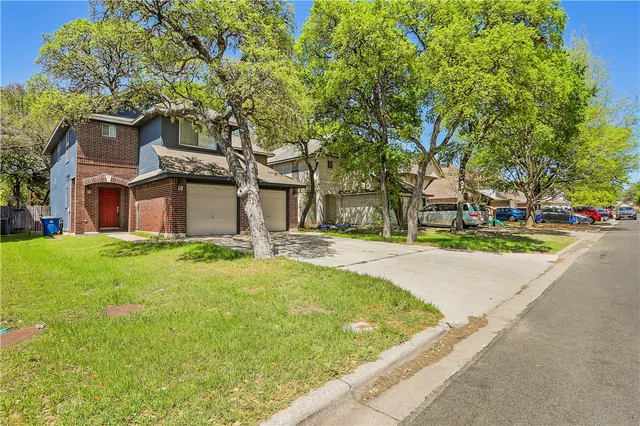 a house with palm tree in front of it