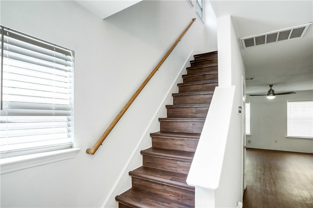9614 Nightjar Drive, Unit A Austin, TX 78748 - Photo 18 of 34 a view of staircase with white walls and windows