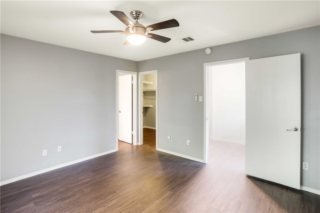 9614 Nightjar Drive, Unit A Austin, TX 78748 - Photo 19 of 34 a view of an empty room with wooden floor