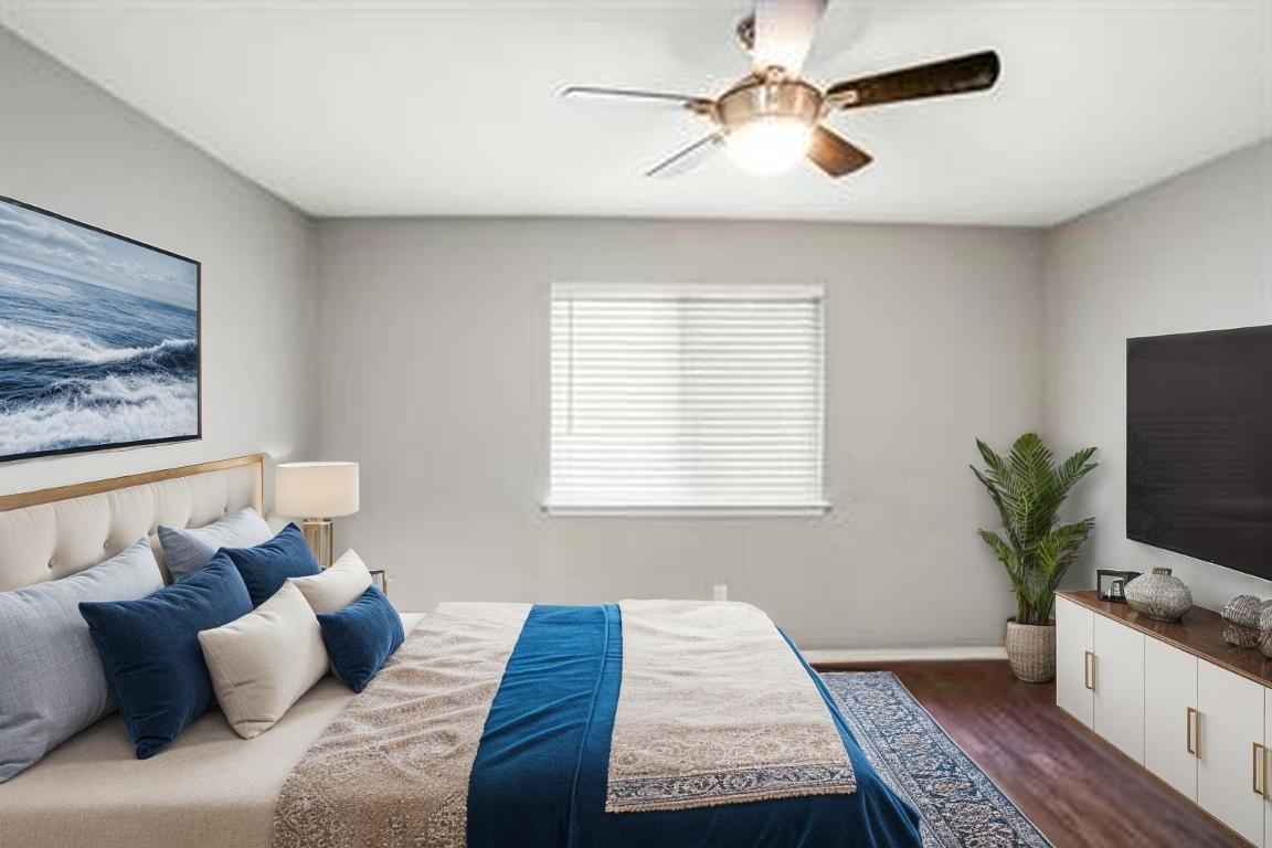 9614 Nightjar Drive, Unit A Austin, TX 78748 - Photo 20 of 34 a bedroom with a large bed and a couch