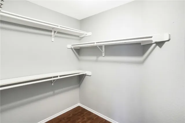 a view of an empty walk in closet