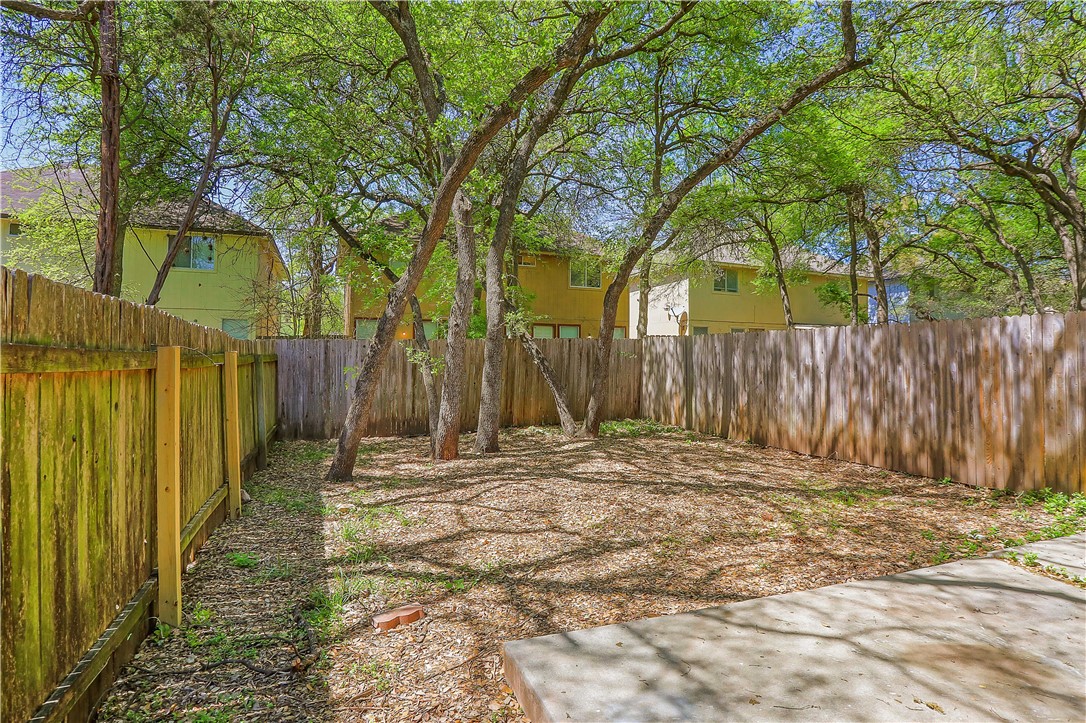 9614 Nightjar Drive, Unit A Austin, TX 78748 - Photo 34 of 34 a view of a backyard with wooden fence