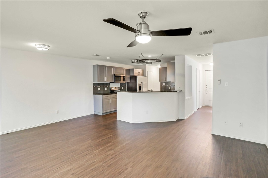 9614 Nightjar Drive, Unit A Austin, TX 78748 - Photo 9 of 34 a view of a kitchen with a sink and wooden floor