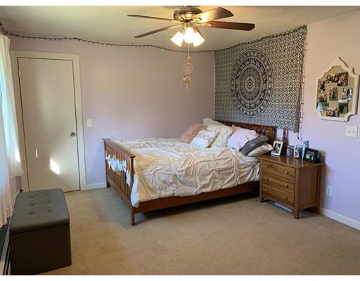 205 Podunk Road Sturbridge, MA 01566 - Photo 12 of 30 a bedroom with a bed dresser and a window