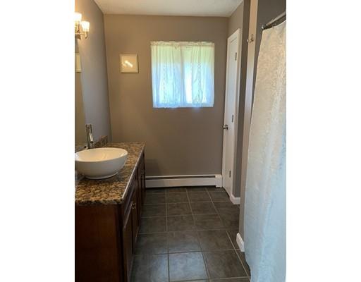 205 Podunk Road Sturbridge, MA 01566 - Photo 13 of 30 a bathroom with a sink and a toilet